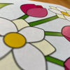 Colorful tactile flower illustrations on a white background.