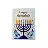 Front of Happy hanukkah card with lit blue menorah and braille greeting
