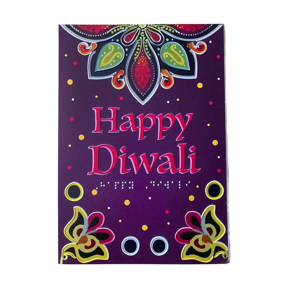 A rectangular purple greeting card with colorful Diwali-themed illustrations, including a mandala at the top, decorative flowers at the bottom corners, and the words 'Happy Diwali' in pink lettering, shown on a plain white background.