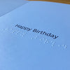 Inside of card with 'Happy Birthday' text in Braille