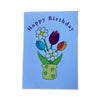 Birthday card with colorful flowers and 'Happy Birthday' text with braille on a blue background