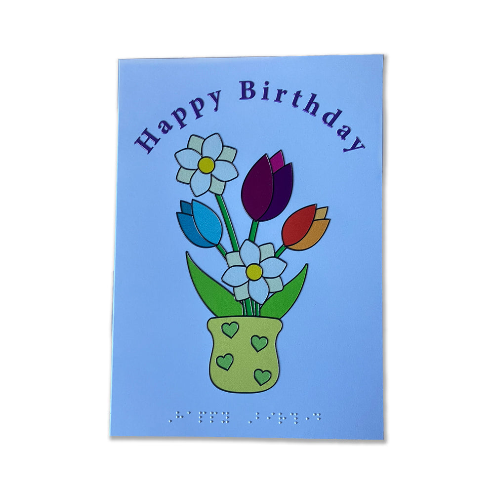 Birthday card with colorful flowers and 'Happy Birthday' text with braille on a blue background