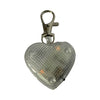 Heart-shaped light-up dog tag on white background