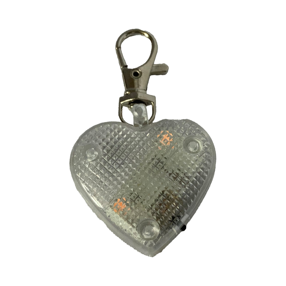 Heart-shaped light-up dog tag on white background