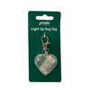 Heart-shaped light-up dog tag on white background with packaging