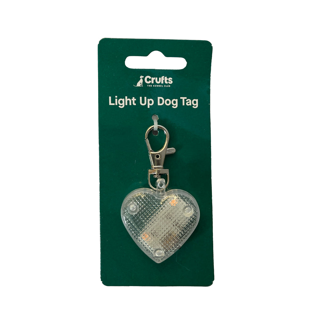 Heart-shaped light-up dog tag on white background with packaging