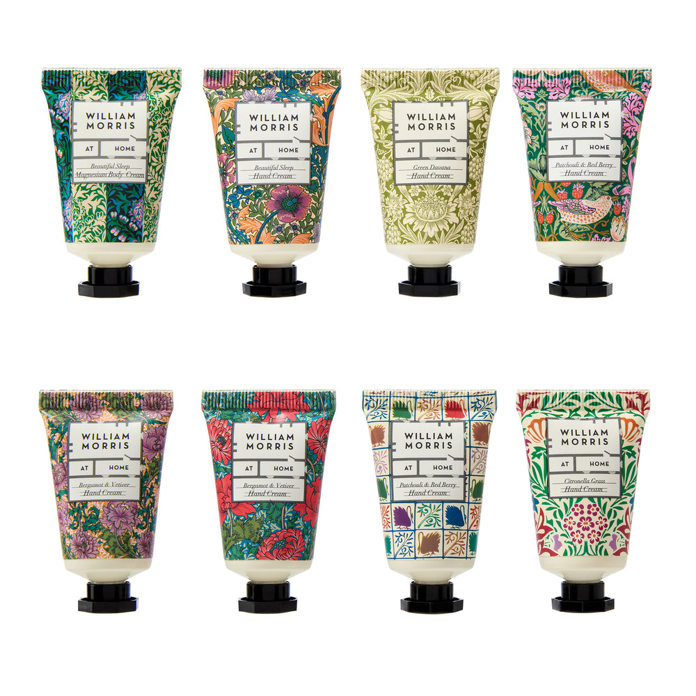 Set of William Morris hand cream bottles with floral designs on a white background