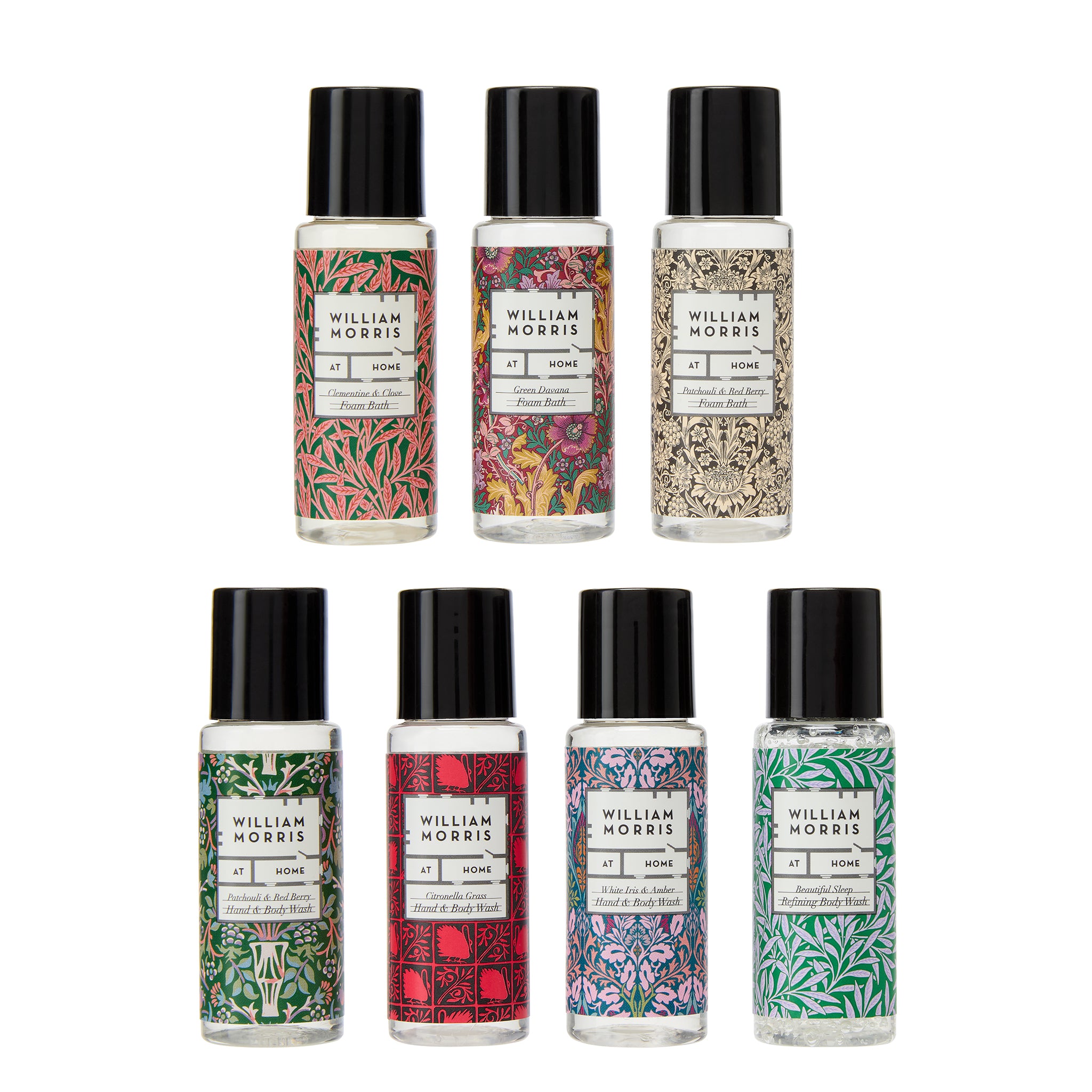 Set of eight William Morris perfume bottles with various designs on a white background
