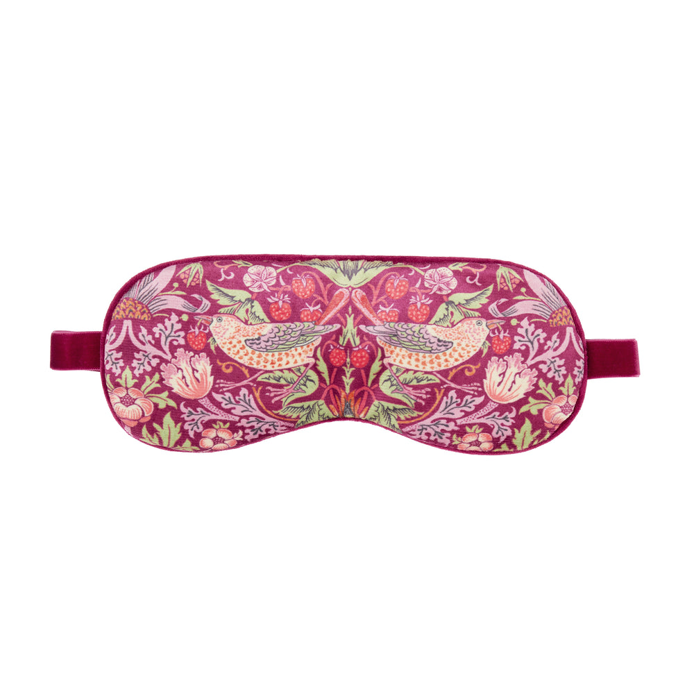 Sleep mask with floral and bird pattern on a white background