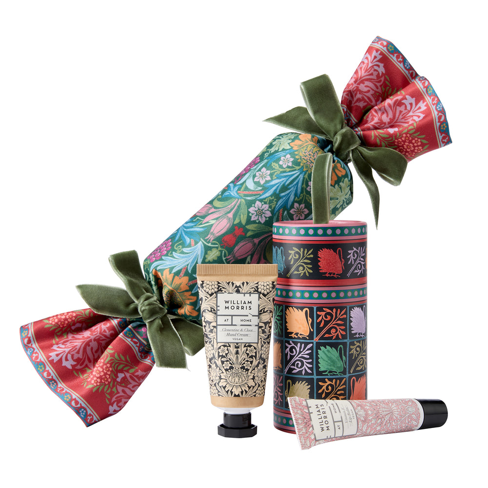 Set of beauty products with decorative packaging on a white background