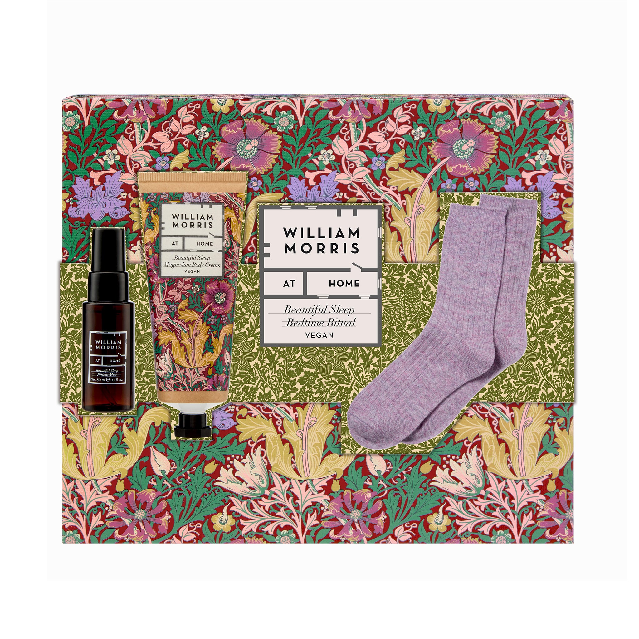 Gift set with body cream, pillow mist, and socks on a decorative box with floral design.