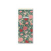 Floral patterned notebook with a white label on a white background.