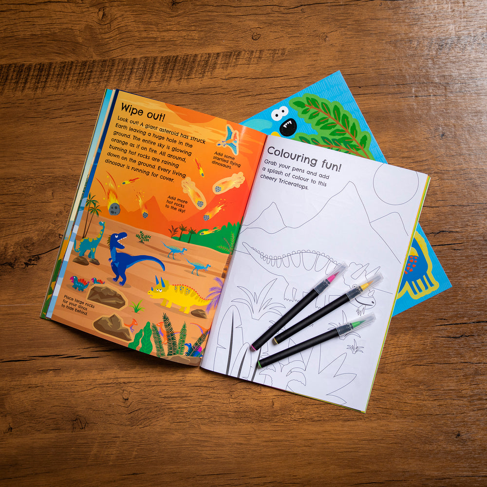 Children's activity book with coloring page and markers on a wooden surface