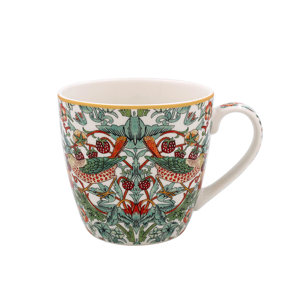 Decorative mug with bird and berry pattern on a white background.