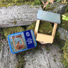 Wooden bird feeder kit with packaging on a natural background