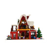 Toy house with a Christmas theme made of building blocks on a white background