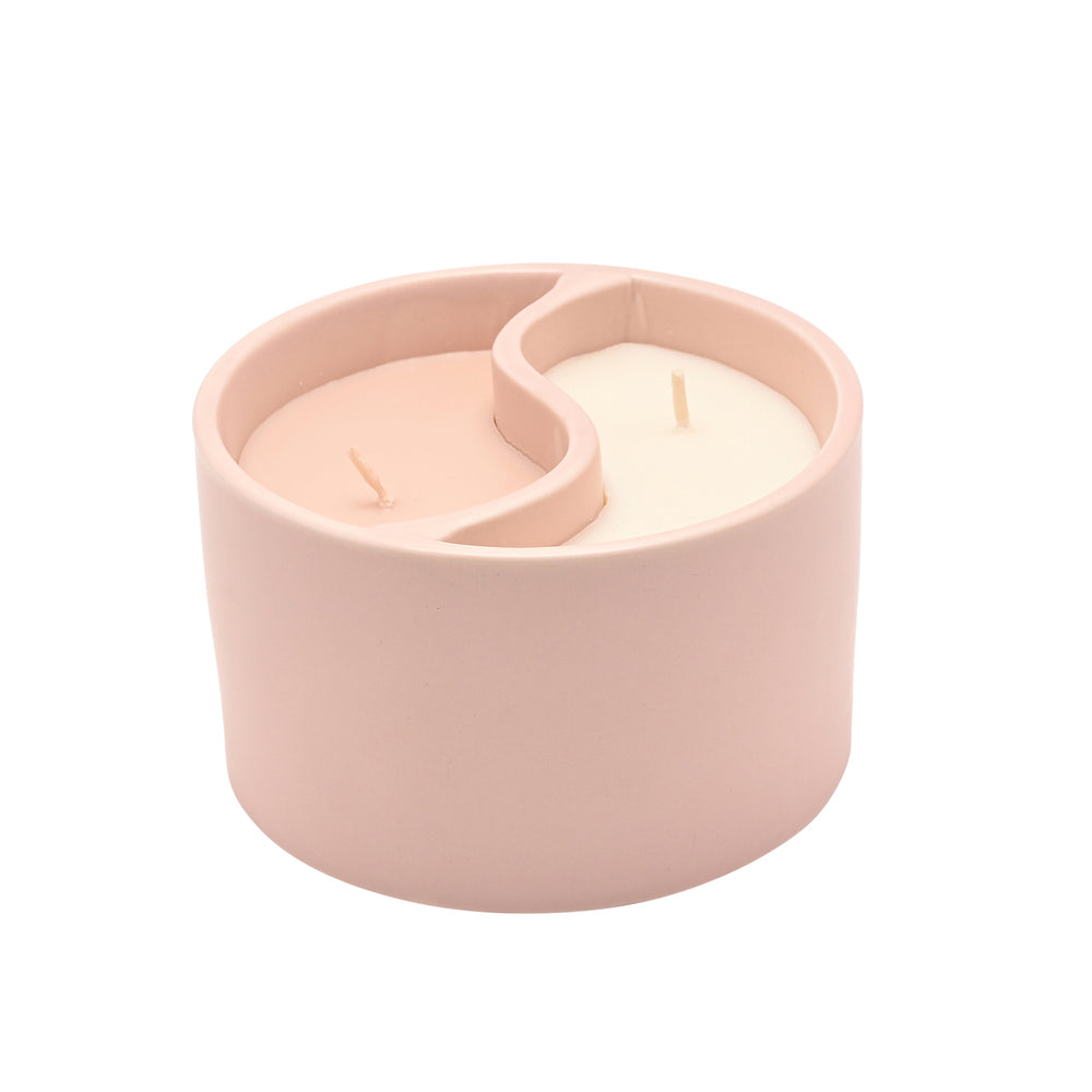 Pink candle holder with a candle inside on a white background