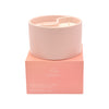 Pink candle in a pink box with 'Serenity' branding on a white background