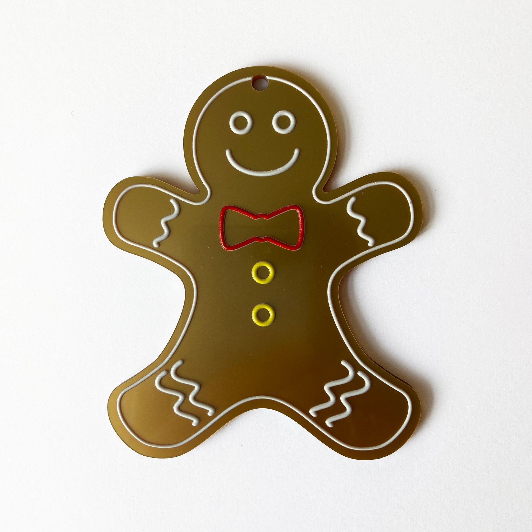 Gingerbread man tree decoration on a white background