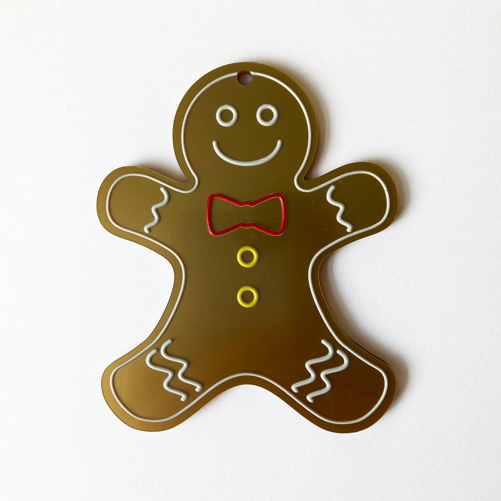 Gingerbread man tree decoration on a white background