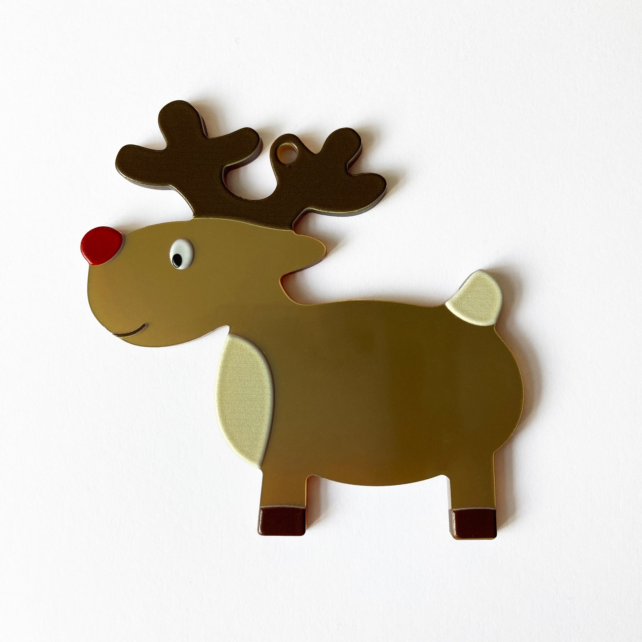 Decorative reindeer ornament on a white background