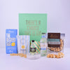 Gin-themed gift set with bottles, packaging, and snacks on a white background