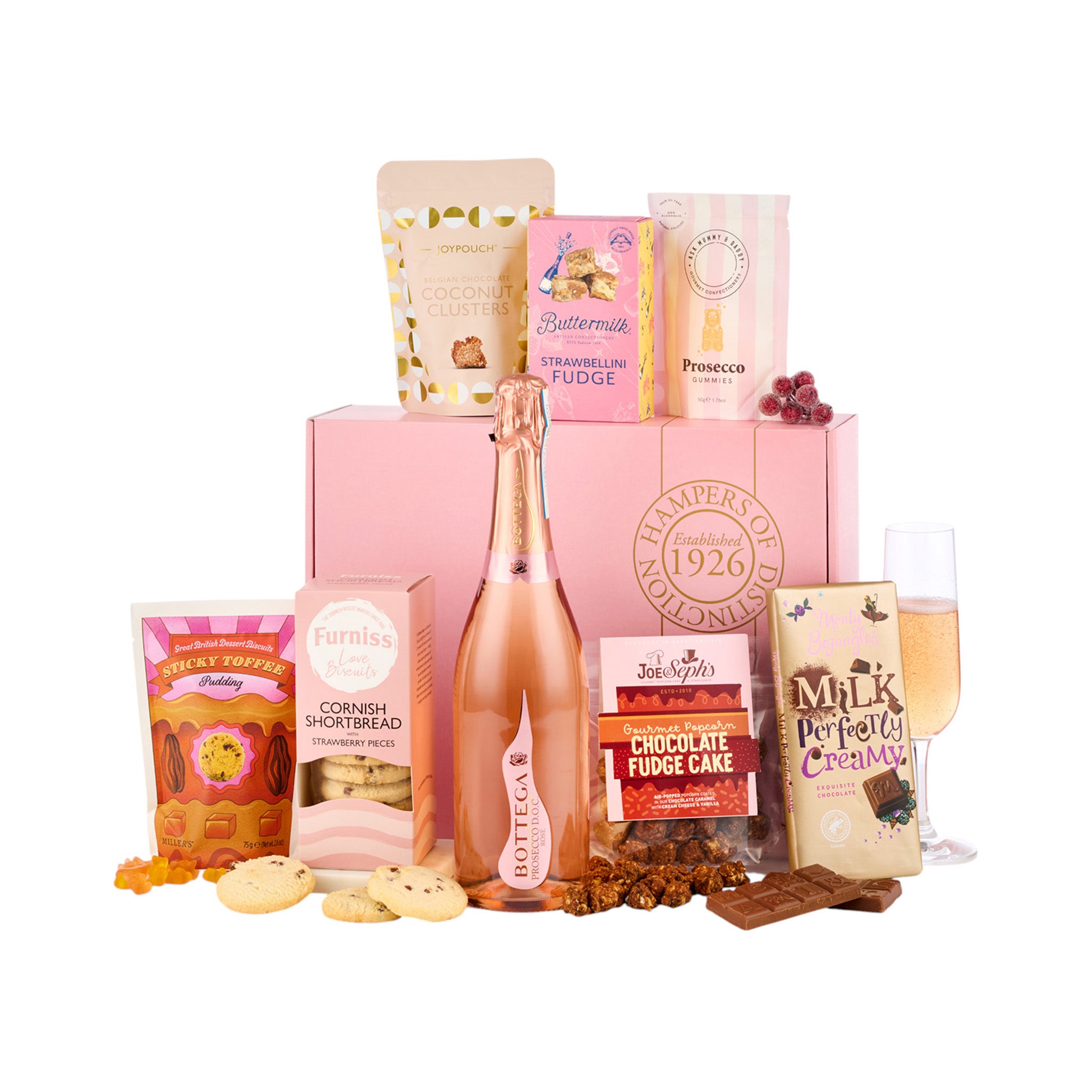 Gift basket with a bottle of Prosecco, cookies, and other snacks on a white background