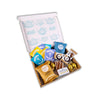 Tea gift set with a variety of teas and treats on a white background