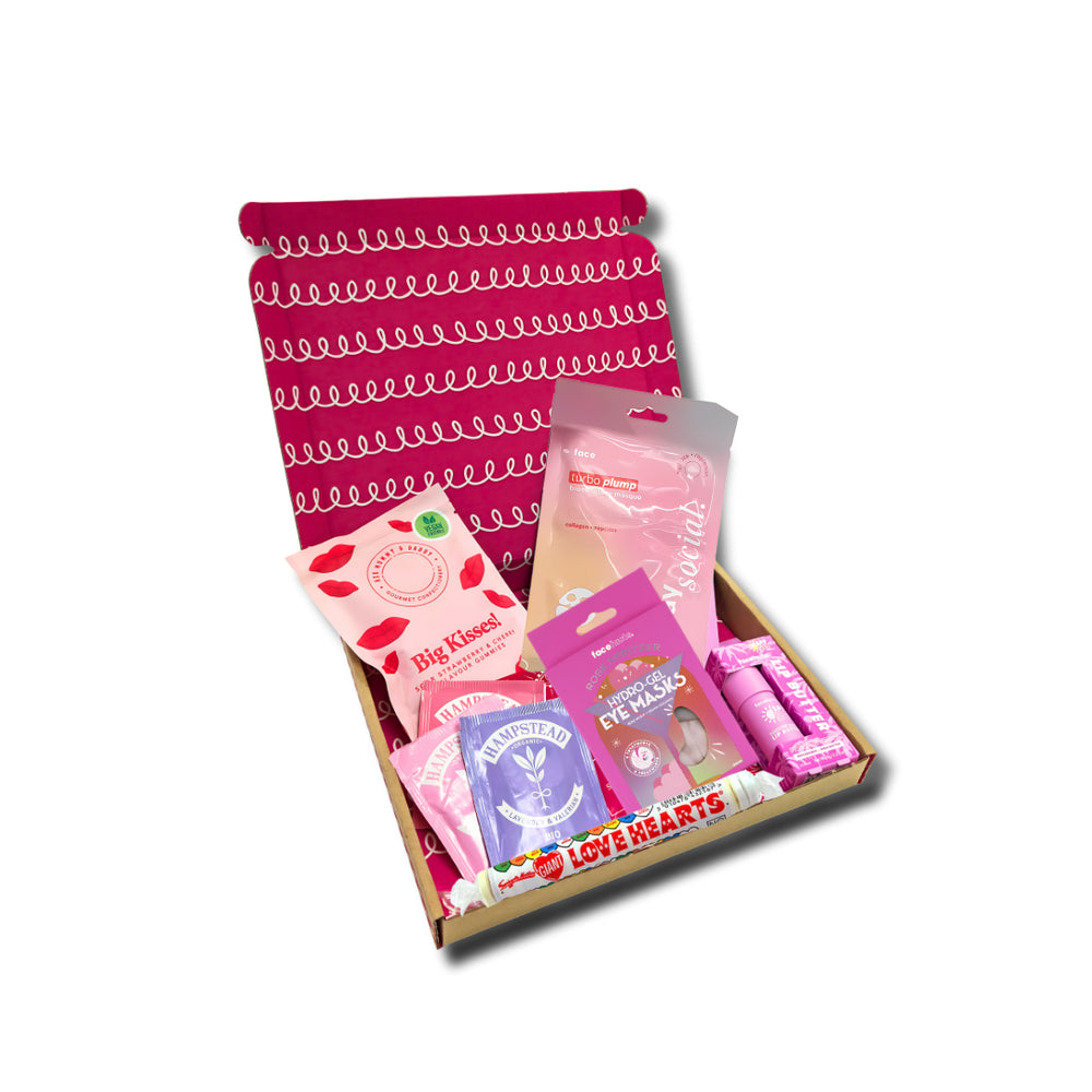Box of sweet treats, also a lip balm in a box on a white background