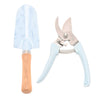 Gardening tool set with light blue pruner and trowel on a white background