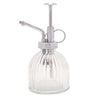 Vintage-style glass plant mister with silver metal nozzle on a white background
