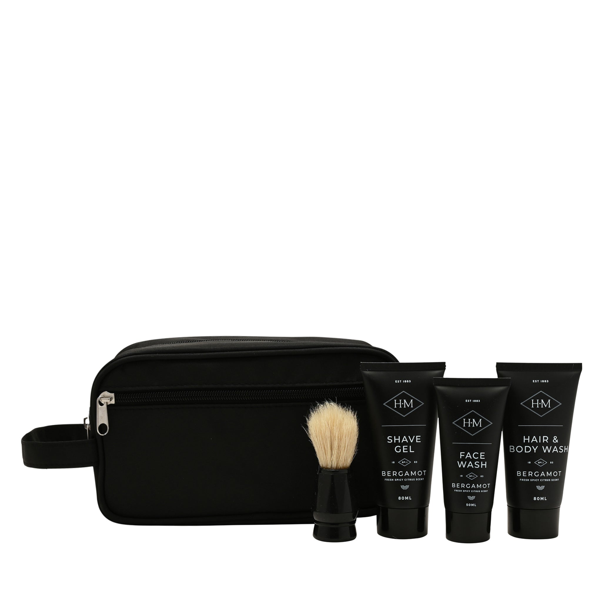 Black toiletry bag with shaving brush and three bottles of grooming products on a white background