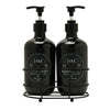 Two black bottles with pump dispensers on a white background
