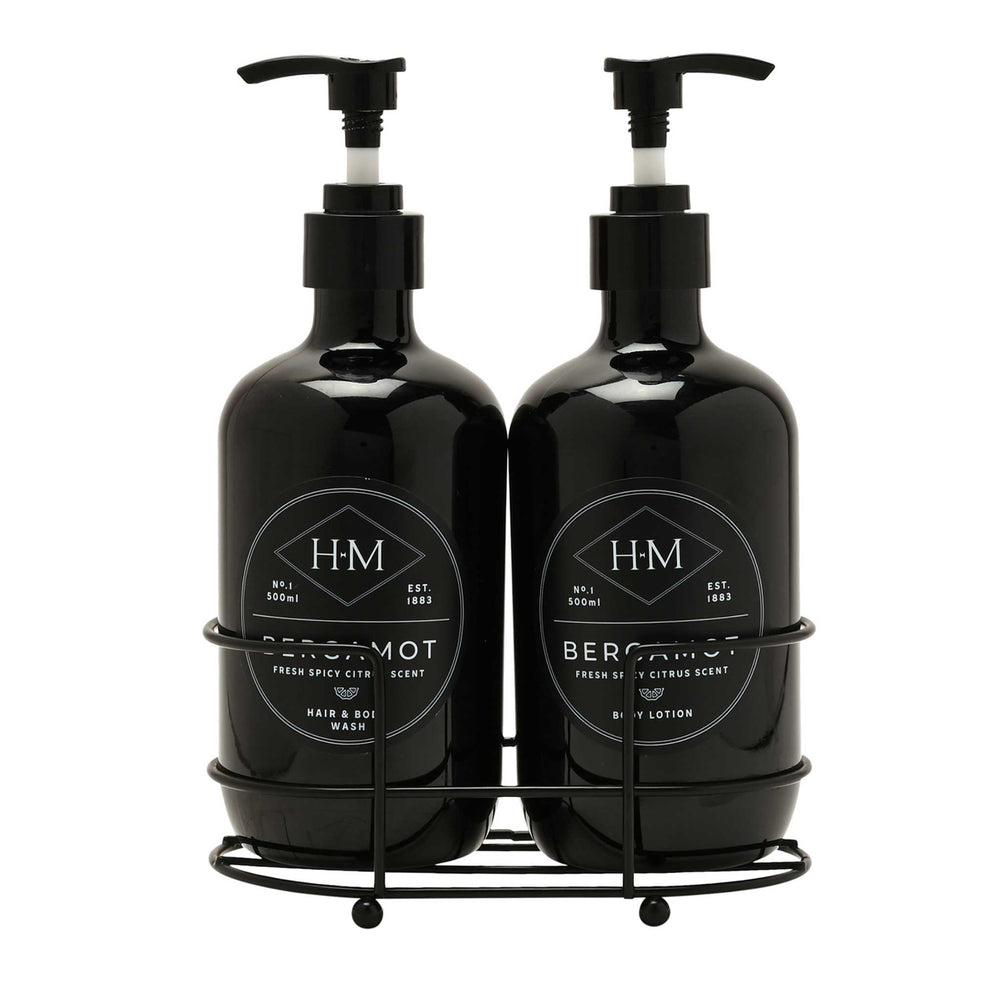 Two black bottles with pump dispensers on a white background