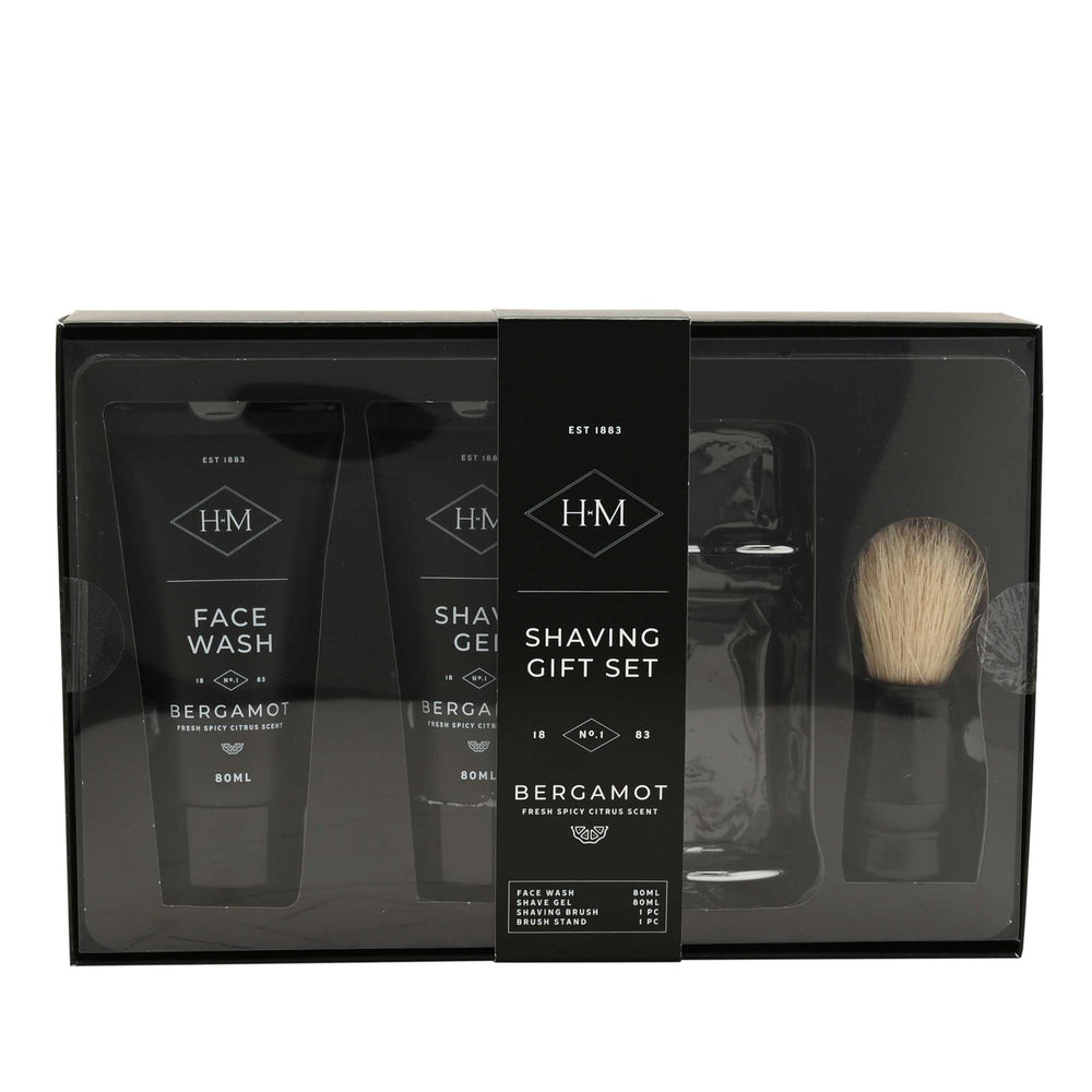 Shaving gift set with face wash, shaving gel, and brush in a black box.