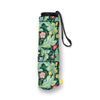 A rolled-up folding umbrella with a black wrist strap, featuring a classic green and blue botanical pattern with pink and yellow flowers, shown on a white background.