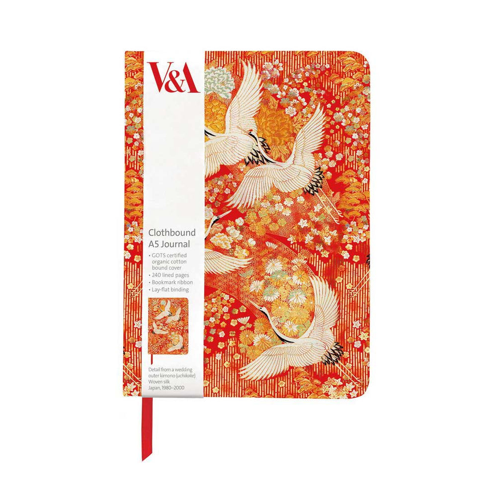 A V&A clothbound A5 journal with a red and orange Japanese-style cover featuring white cranes and cherry blossoms, shown on a plain white background.