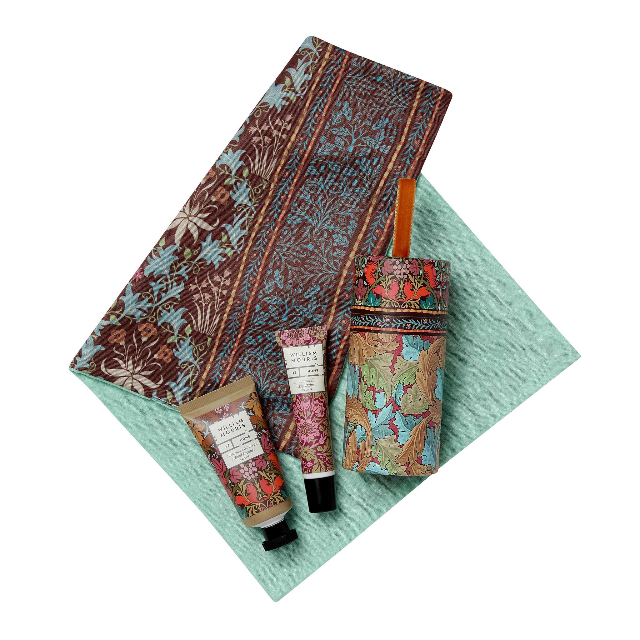 A hand, foot, and knee care gift set on a mint green background.