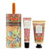 William Morris 'Pomegranate & Fig Butter' hand cream and hand wash gift set, featuring a cylindrical box with a handle, a squeeze tube, and a squeeze bottle, all decorated with a colorful William Morris pattern of pomegranates and fig leaves, on a white background.