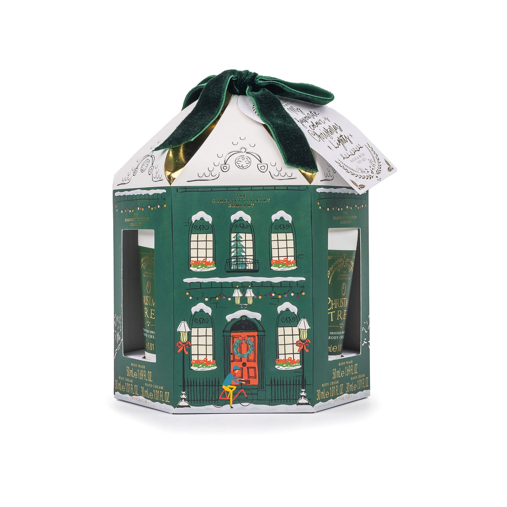 Mini pamper set in hexagonal green gift box designed like a house with a white roof and green ribbon on a white background