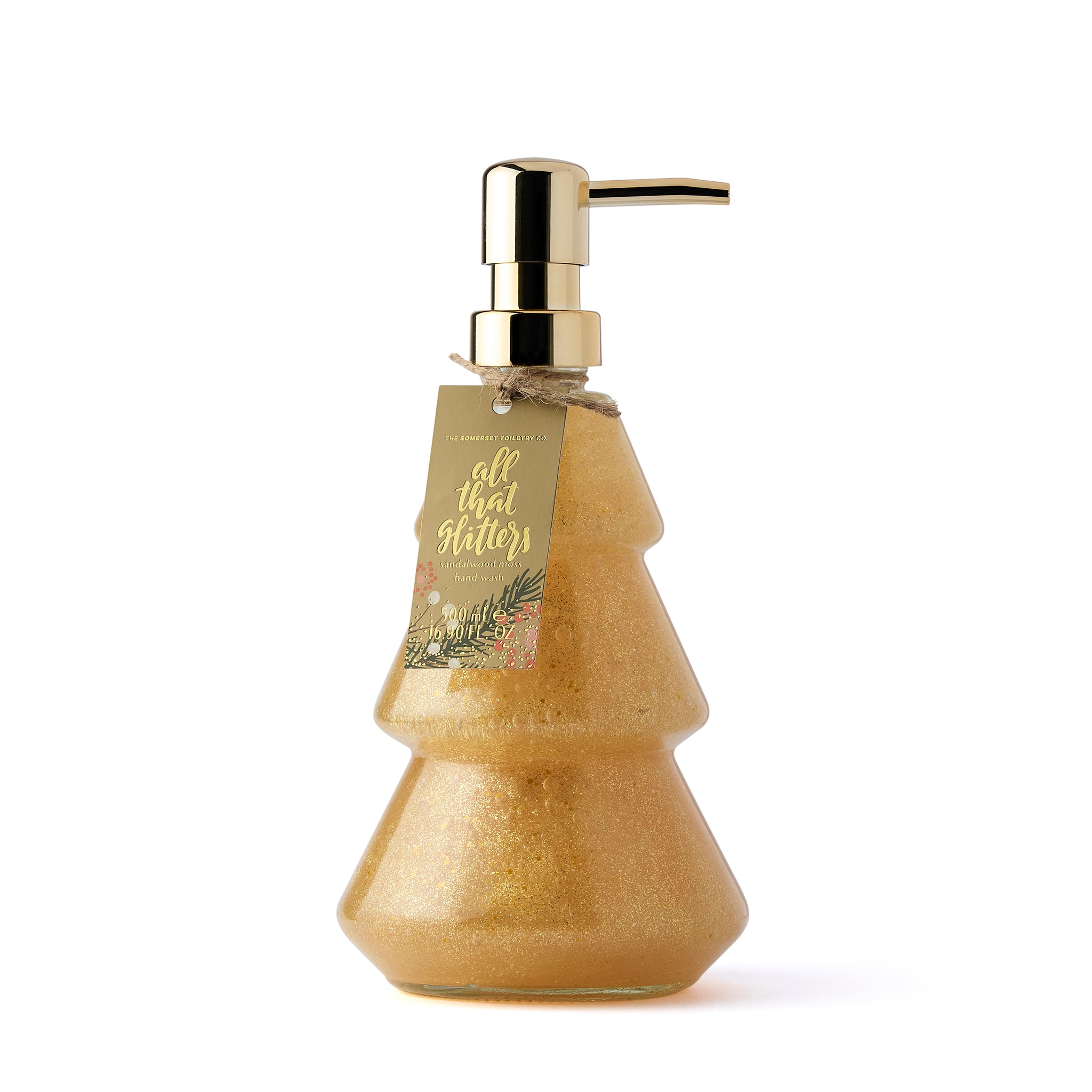 Gold glittery Christmas tree shaped soap dispenser with pump on a white background