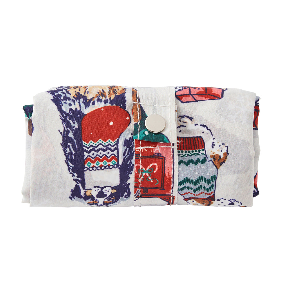 Folded tote bag with Christmas-themed pattern on a white background.