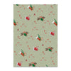 Patterned paper with cartoon dogs in winter clothing on a light green background