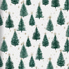 Wrapping paper featuring a pattern of green Christmas trees and gold stars on a light background