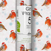 Roll of gift wrap with Christmas robin design on a white background