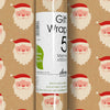 Roll of gift wrap with Santa Claus design on a brown background