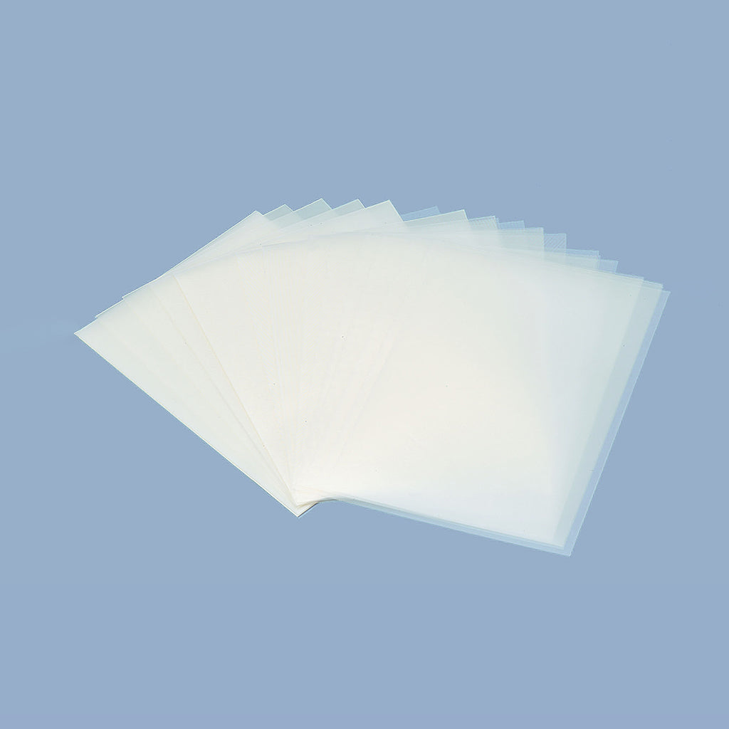 Sheets of German film fanned out on a light blue background
