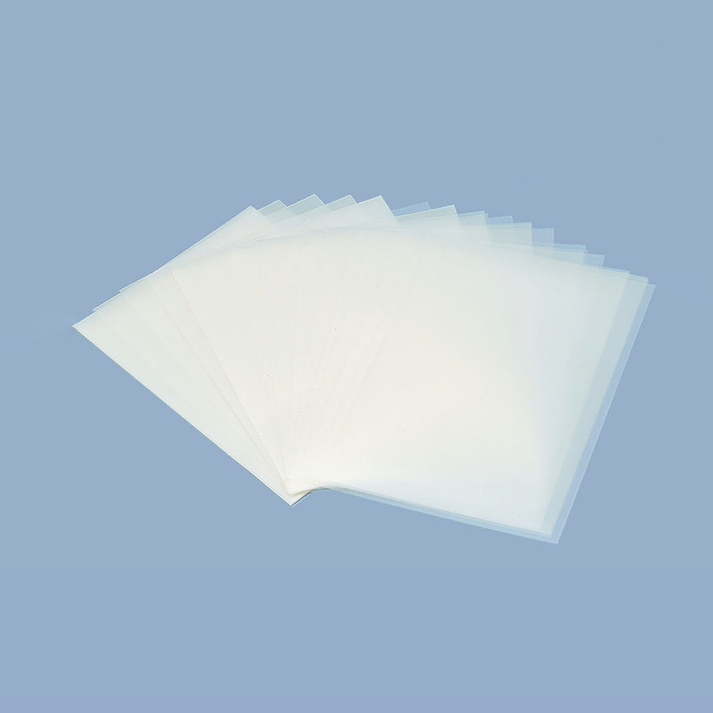 Sheets of German film fanned out on a light blue background